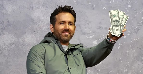 Ryan Reynolds holding money